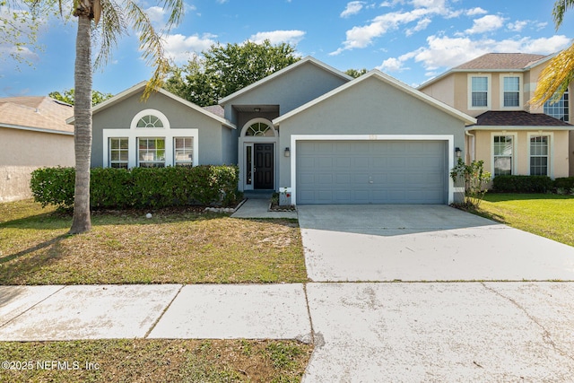 133 Sterling Hill Dr, Jacksonville, FL 32225 - view of front of house featuring a garage, stucco siding, a front yard, and driveway