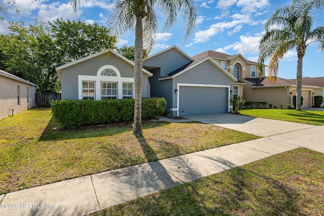 133 Sterling Hill Dr, Jacksonville, FL 32225 - view of front of house with stucco siding, an attached garage, and concrete driveway