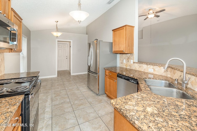 133 Sterling Hill Dr, Jacksonville, FL 32225 - kitchen featuring a sink, stainless steel appliances, vaulted ceiling, decorative backsplash, and ceiling fan