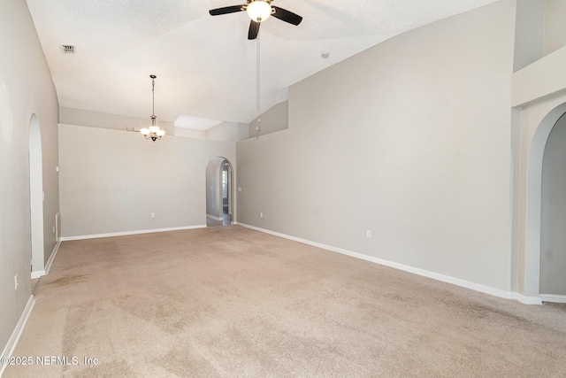 133 Sterling Hill Dr, Jacksonville, FL 32225 - spare room featuring arched walkways, vaulted ceiling, a ceiling fan, and light colored carpet