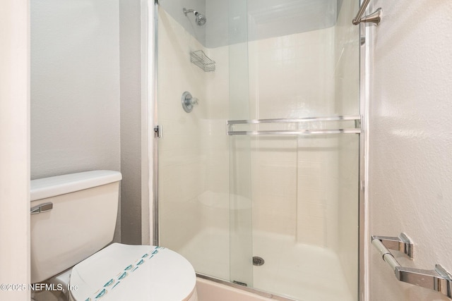 133 Sterling Hill Dr, Jacksonville, FL 32225 - bathroom with toilet, a shower stall, and a textured wall