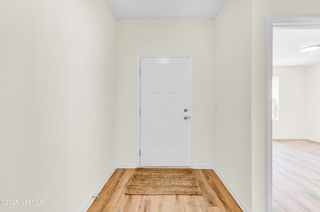 1902 Gillis St, Palatka, FL 32177 - doorway featuring light wood-style flooring and baseboards