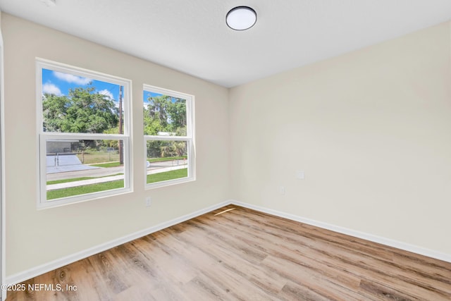 1902 Gillis St, Palatka, FL 32177 - empty room with wood finished floors and baseboards