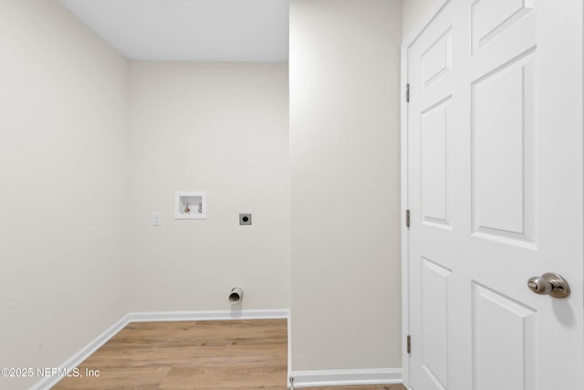 1902 Gillis St, Palatka, FL 32177 - clothes washing area with electric dryer hookup, washer hookup, light wood-type flooring, and baseboards