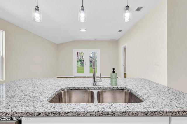 1902 Gillis St, Palatka, FL 32177 - kitchen featuring a sink, light stone counters, french doors, and pendant lighting