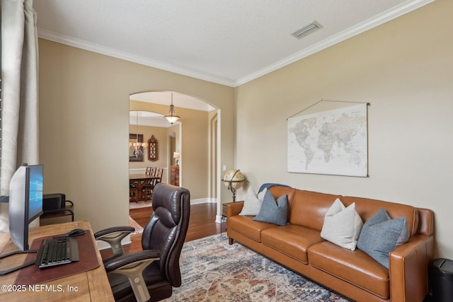 1700 Eagle Watch Dr, Fleming Island, FL 32003 - office area with wood finished floors, ornamental molding, arched walkways, baseboards, and a chandelier