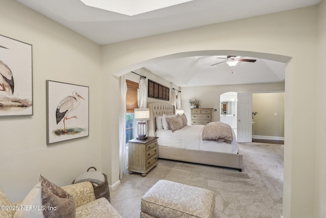 1700 Eagle Watch Dr, Fleming Island, FL 32003 - bedroom with arched walkways, light carpet, baseboards, and ceiling fan