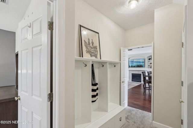 1700 Eagle Watch Dr, Fleming Island, FL 32003 - mudroom featuring a textured ceiling and a fireplace