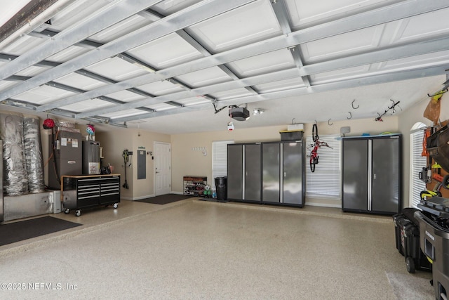1700 Eagle Watch Dr, Fleming Island, FL 32003 - garage with gas water heater, a garage door opener, heating unit, and baseboards