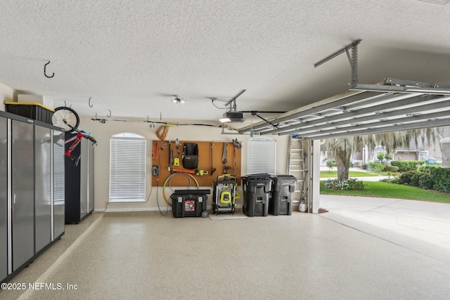 1700 Eagle Watch Dr, Fleming Island, FL 32003 - garage featuring a garage door opener and baseboards