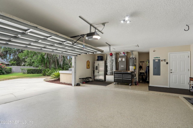 1700 Eagle Watch Dr, Fleming Island, FL 32003 - garage featuring a garage door opener, stainless steel fridge, electric panel, and gas water heater