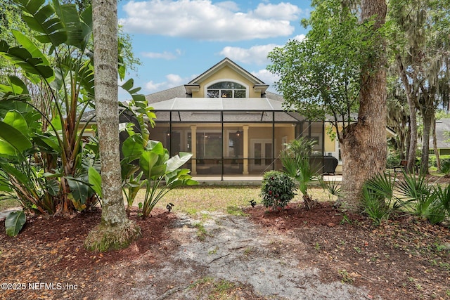 1700 Eagle Watch Dr, Fleming Island, FL 32003 - rear view of house featuring a lanai, french doors, and stucco siding