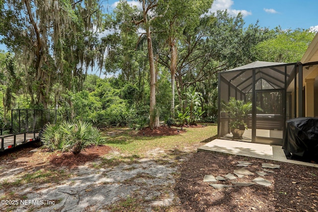 1700 Eagle Watch Dr, Fleming Island, FL 32003 - view of yard with glass enclosure and a patio