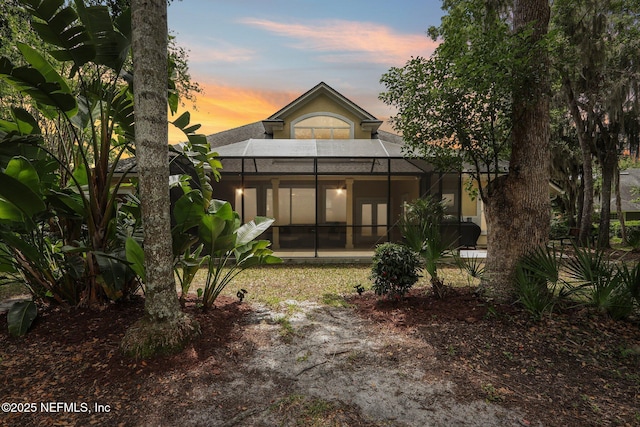 1700 Eagle Watch Dr, Fleming Island, FL 32003 - rear view of property with a lanai and stucco siding