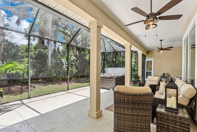 1700 Eagle Watch Dr, Fleming Island, FL 32003 - sunroom with a hot tub, ceiling fan, and an outdoor living space
