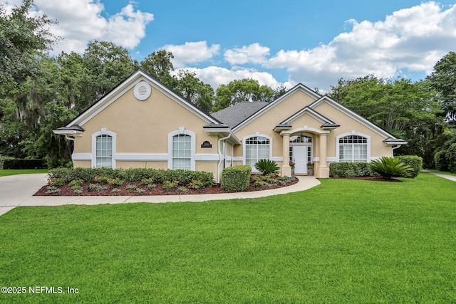 1700 Eagle Watch Dr, Fleming Island, FL 32003 - single story home featuring a front lawn and stucco siding