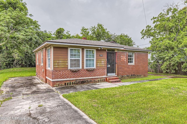 3324 Sunnybrook Ave S, Jacksonville, FL 32254 - view of front facade with brick siding, a front lawn, entry steps, and a chimney