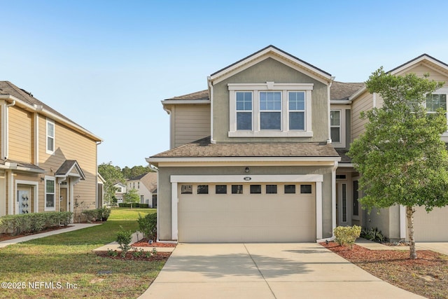 168 Nelson Ln, Saint Johns, FL 32259 - view of front of home with driveway, an attached garage, stucco siding, a front yard, and a shingled roof