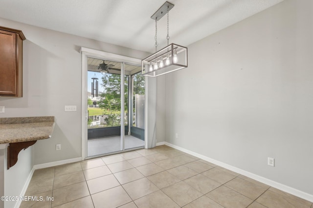 168 Nelson Ln, Saint Johns, FL 32259 - unfurnished dining area featuring light tile patterned floors, a ceiling fan, and baseboards