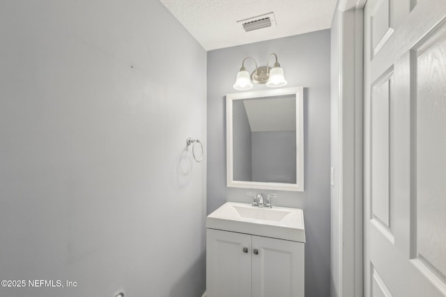 168 Nelson Ln, Saint Johns, FL 32259 - bathroom with vanity, a chandelier, and a textured ceiling