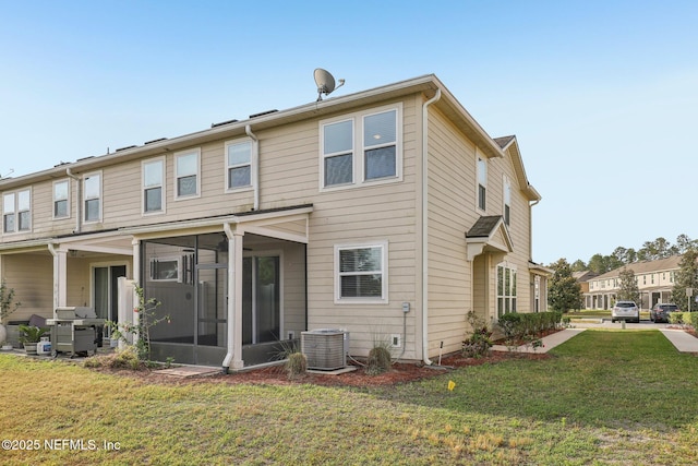 168 Nelson Ln, Saint Johns, FL 32259 - back of house featuring a sunroom, central AC, and a yard