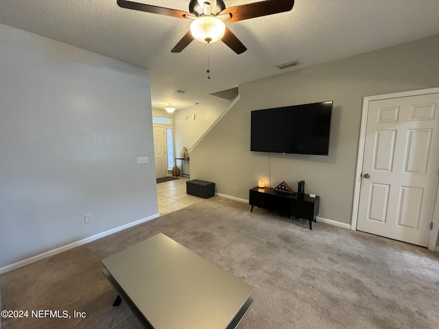 676 Reese Ave, Orange Park, FL 32065 - carpeted living room featuring a ceiling fan, a textured ceiling, and baseboards