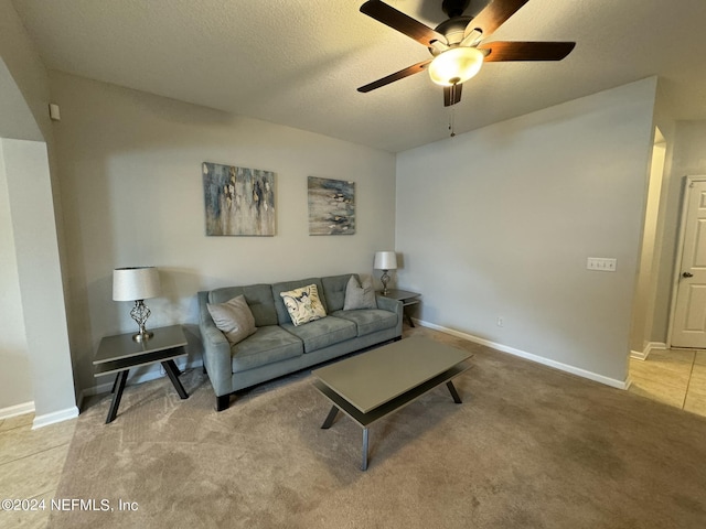676 Reese Ave, Orange Park, FL 32065 - living area featuring ceiling fan, light colored carpet, baseboards, and a textured ceiling