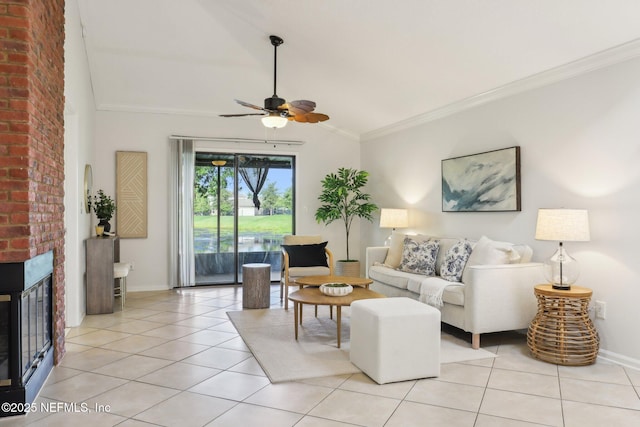 9250 Arbolita Way, Jacksonville, FL 32256 - living area featuring vaulted ceiling, light tile patterned floors, a fireplace, baseboards, and ceiling fan