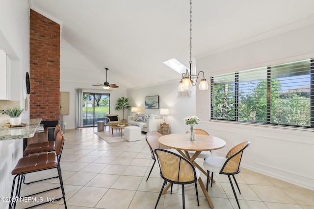 9250 Arbolita Way, Jacksonville, FL 32256 - dining space with crown molding, light tile patterned flooring, a ceiling fan, vaulted ceiling, and a skylight
