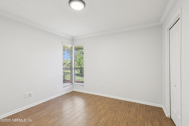 9250 Arbolita Way, Jacksonville, FL 32256 - unfurnished bedroom featuring ornamental molding, baseboards, wood finished floors, and a closet