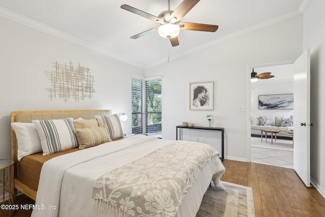 9250 Arbolita Way, Jacksonville, FL 32256 - bedroom featuring lofted ceiling, wood finished floors, crown molding, a ceiling fan, and baseboards
