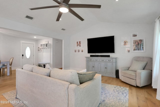 1257 12th St N, Jacksonville Beach, FL 32250 - living room featuring ceiling fan, lofted ceiling, light wood-type flooring, and baseboards