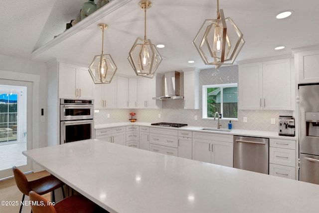 1257 12th St N, Jacksonville Beach, FL 32250 - kitchen with stainless steel appliances, a sink, wall chimney range hood, backsplash, and recessed lighting