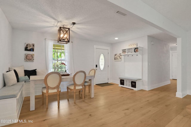 1257 12th St N, Jacksonville Beach, FL 32250 - dining area featuring a textured ceiling, light wood-style flooring, baseboards, and recessed lighting