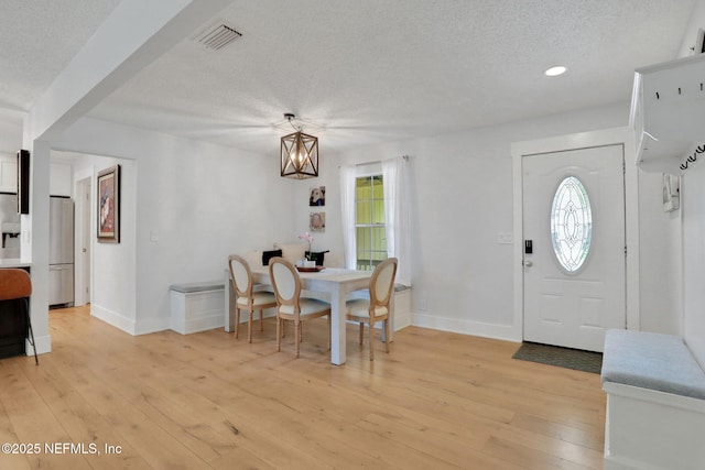 1257 12th St N, Jacksonville Beach, FL 32250 - dining area with a textured ceiling, baseboards, light wood-style flooring, a chandelier, and recessed lighting