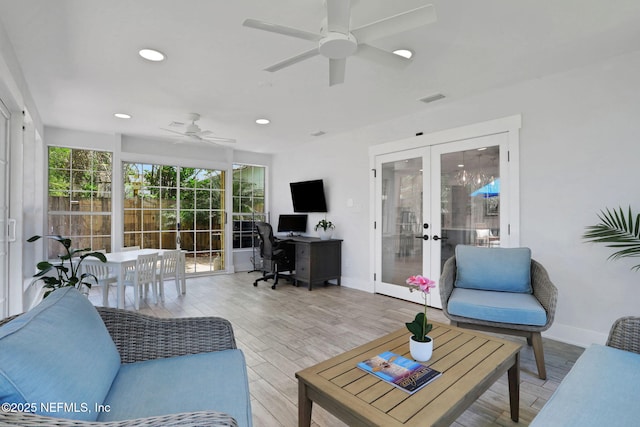1257 12th St N, Jacksonville Beach, FL 32250 - living room with french doors, a ceiling fan, a desk, baseboards, and wood finished floors