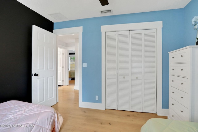 1257 12th St N, Jacksonville Beach, FL 32250 - bedroom featuring light wood-style floors, a closet, baseboards, and ceiling fan