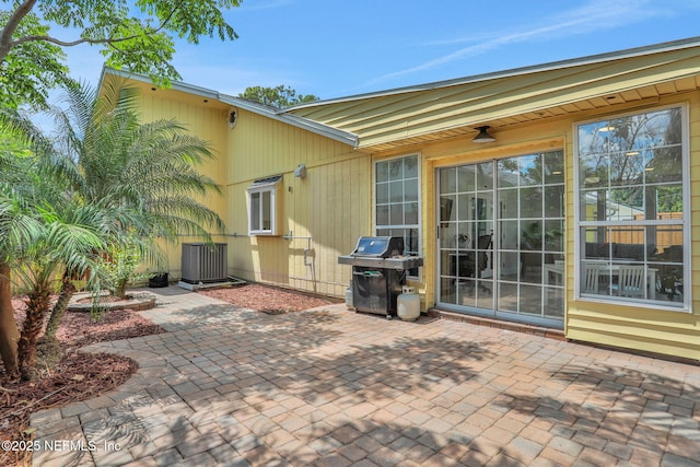 1257 12th St N, Jacksonville Beach, FL 32250 - view of patio featuring a grill and central air condition unit