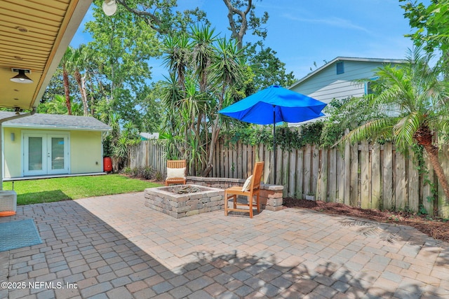1257 12th St N, Jacksonville Beach, FL 32250 - view of patio featuring an outdoor fire pit and french doors