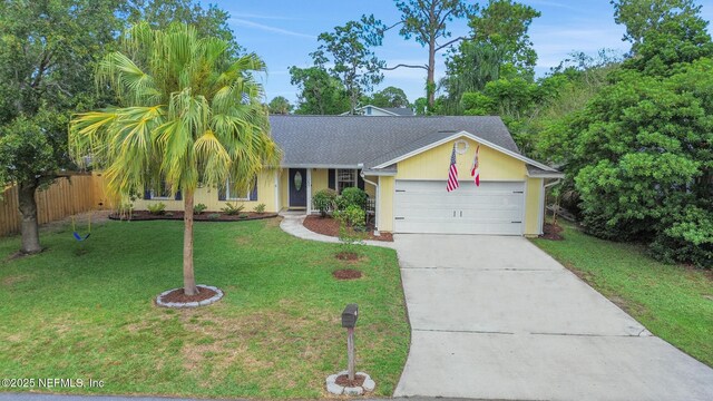 1257 12th St N, Jacksonville Beach, FL 32250 - view of front facade featuring driveway, an attached garage, and a shingled roof