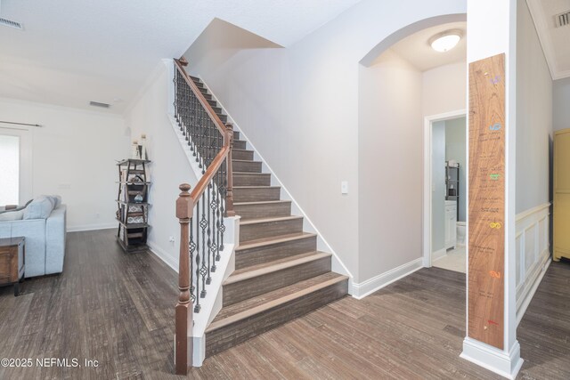1800 Rear Admiral Ln, Saint Johns, FL 32259 - stairs featuring wood finished floors and arched walkways