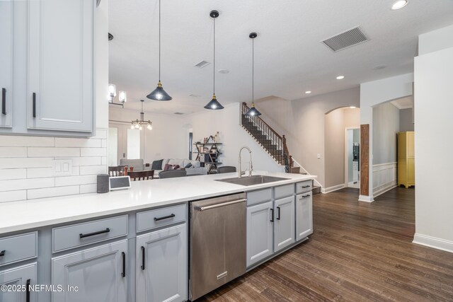 1800 Rear Admiral Ln, Saint Johns, FL 32259 - kitchen featuring a sink, dishwasher, arched walkways, dark wood-type flooring, and tasteful backsplash