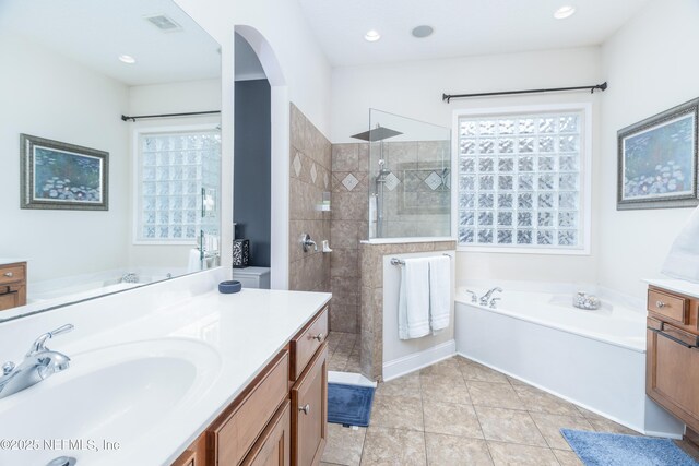 1800 Rear Admiral Ln, Saint Johns, FL 32259 - bathroom with vanity, a garden tub, walk in shower, and recessed lighting