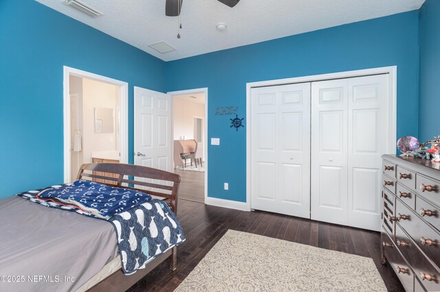 1800 Rear Admiral Ln, Saint Johns, FL 32259 - bedroom with hardwood / wood-style floors, a closet, baseboards, a ceiling fan, and a textured ceiling