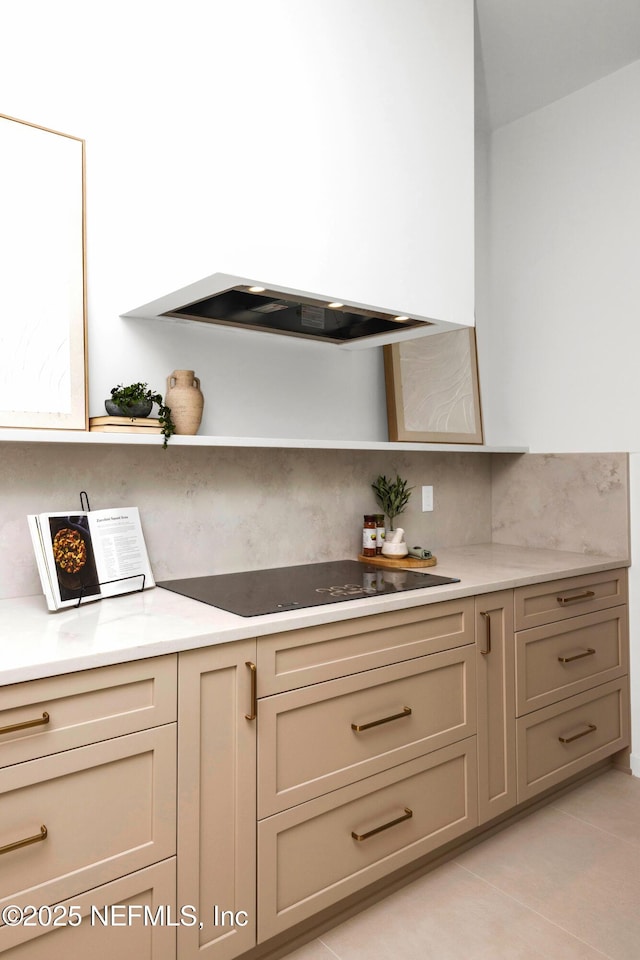 114 12th Ave S Unit 102, Jacksonville Beach, FL 32250 - kitchen featuring open shelves, black electric stovetop, custom range hood, and light countertops