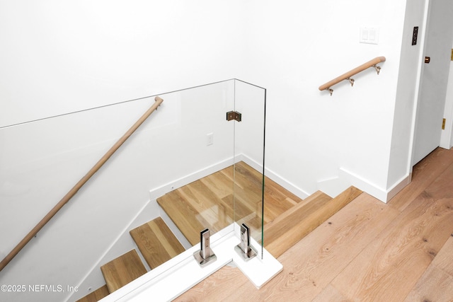 114 12th Ave S Unit 102, Jacksonville Beach, FL 32250 - stairway featuring wood finished floors