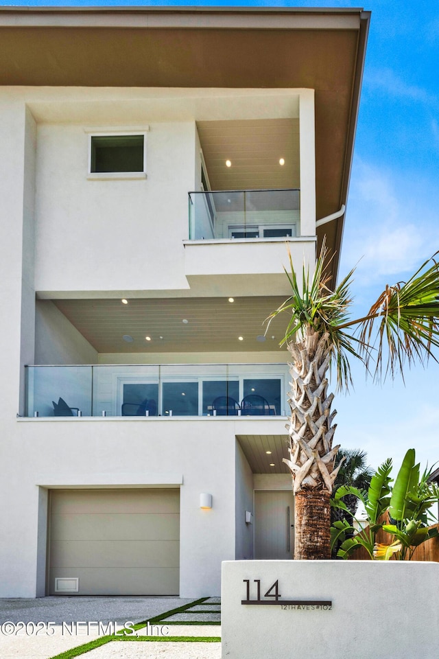 114 12th Ave S Unit 102, Jacksonville Beach, FL 32250 - view of property with a garage