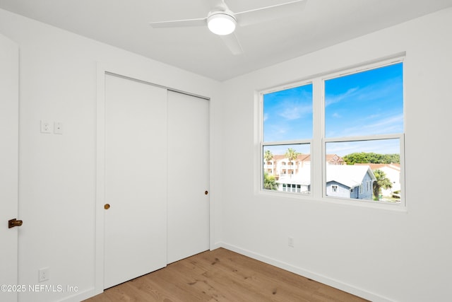 114 12th Ave S Unit 102, Jacksonville Beach, FL 32250 - unfurnished bedroom with light wood finished floors, a closet, and ceiling fan