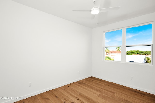 114 12th Ave S Unit 102, Jacksonville Beach, FL 32250 - empty room with light wood finished floors and ceiling fan