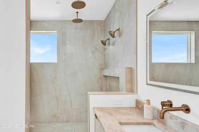 114 12th Ave S Unit 102, Jacksonville Beach, FL 32250 - bathroom featuring a marble finish shower and vanity